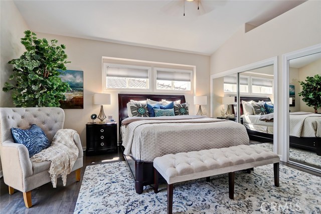 Peaceful master bedroom retreat with dual wardrobe closets and hardwood floors.