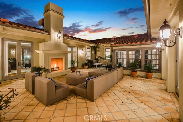 Interior atrium with fireplace is a fantastic place for gathering with the sunshine and private relaxation.