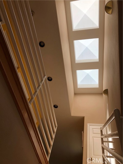 Stairway is illuminated by 3 sky lights.