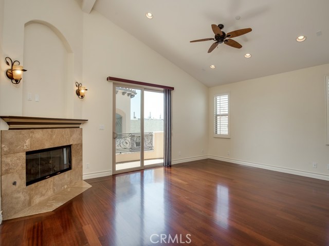 Master bedroom has gorgeous fireplace with stone facade.  Doors lead to balcony.