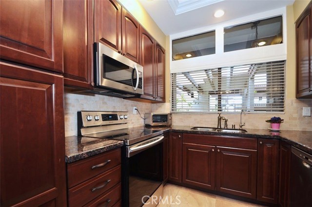 Loads of cabinets in this tastefully remodeled kitchen.