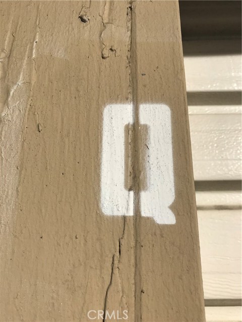 The letter Q next to the garage door