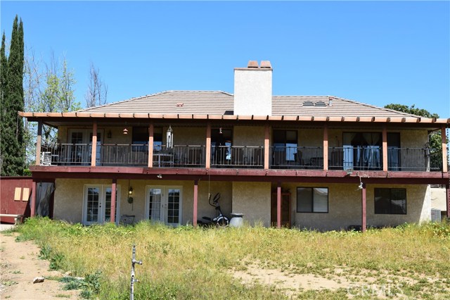 Full Length Deck & Patio at Back of Home with 3 sets of French Doors!