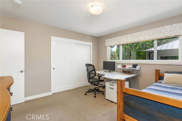 Large closet in 3rd bedroom + big window looking out at yard.