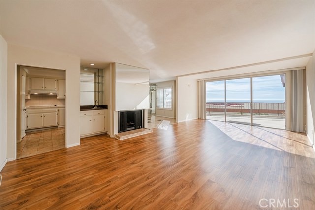 Beautiful Laminate flooring accentuates the open living area.