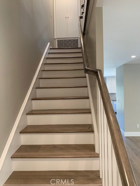 Staircase leading to upstairs bedrooms.