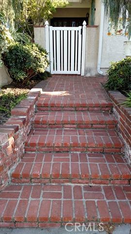 brick steps to the front private gated courtyard