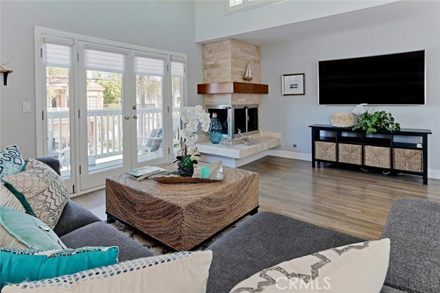 Remodeled fireplace with stacked stone and tumbled travertine.