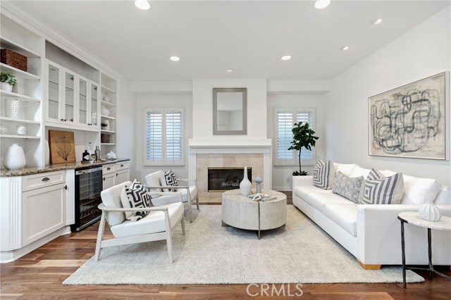 Formal Living Room with Wood Burning Fireplace, Wine Storage and Built-in Cabinetry/Shelving