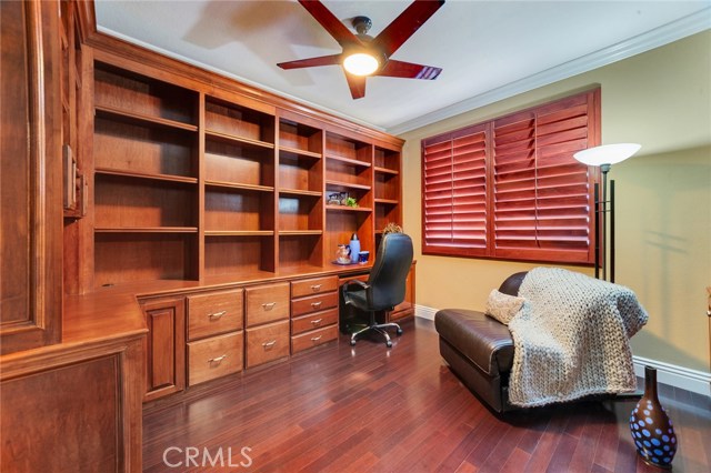 Downstairs bedroom with mirrored closet doors, currently used as office.