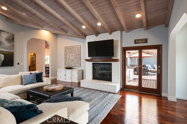 Soaring vaulted ceilings in the family room - imagine a night in with the family enjoying a movie, the city lights views, or just relaxing on the couch with a good book and a fire in the fireplace.