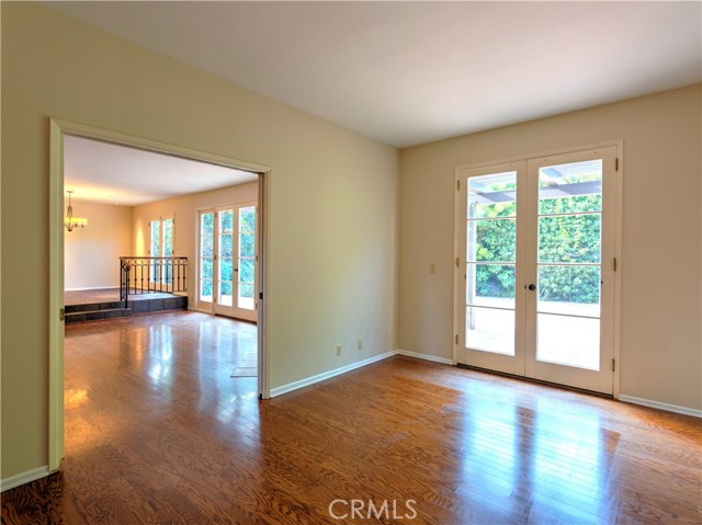 Main floor bedroom opens to backyard.  Separated from LR by pocket doors