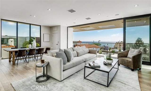 The top floor features the great room that includes the living room, dining room, kitchen, walk in pantry, bath and 2 terraces.