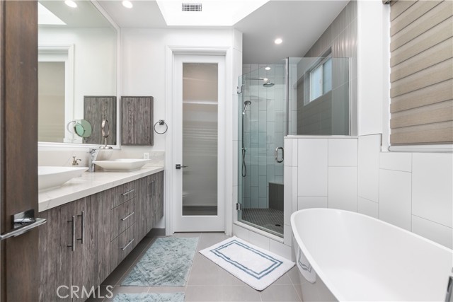 Soaking tub, double-vanity, and oversized shower