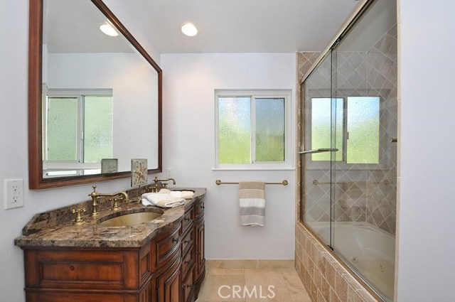 Upstairs Hall Bathroom with Double Sinks and Jetted Tub.