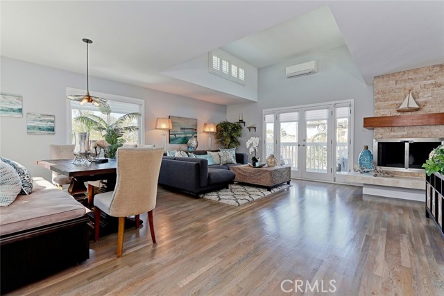 Resurfaced and stained red oak hardwood floors throughout living and dining areas.