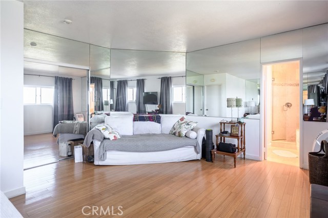 Large master bedroom with panoramic city lights view with walk in closet