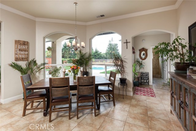 Dining area off of the kitchen with beautiful views out to the backyard and 3rd bathroom and guest bedroom located on this side of home.