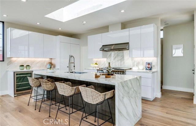 Seamless cabinetry and drawers with unique technology eliminates the need for handles creating a sleep look.