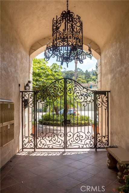 Elegant front gates offer security at courtyard entrance