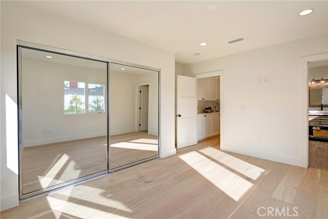 Downstairs large bedroom suite - absolutely tons of natural light.  Located to rear of home.  Private hallway to this suite.