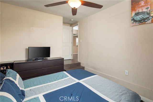 The master bedroom is a spacious rooms with wonderful views of the backyard and sparkling pool.