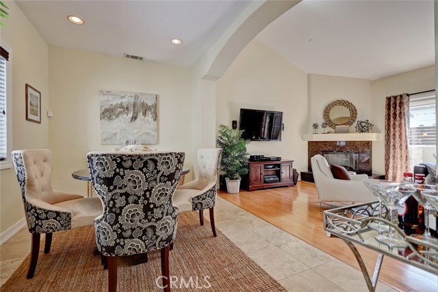 Arched ceilings and baseboards are throughout the dining area and formal living room.