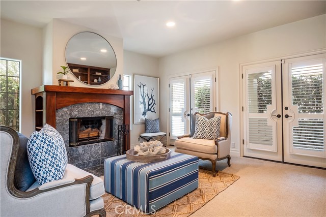 Formal living room with French doors to stone patio
