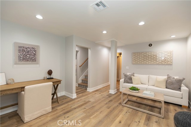Bonus Room Downstairs with Laundry Room, Storage, House Systems, and Entrance from the Garage
