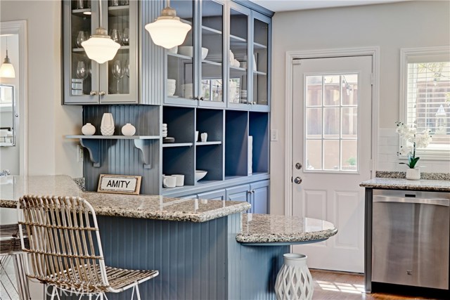 A breakfast bar allows for keeping guests close at hand while working in the kitchen.