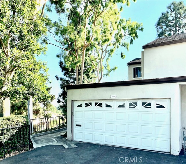 Mature trees surround you. Private 2 car garage. Newer garage door. Room for storage.
