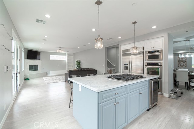 Beautiful Quartz counter-top island and view of family room