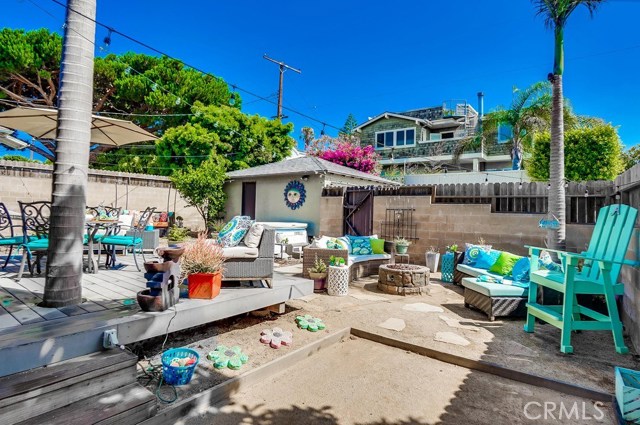 Back yard deck, bocce court and firepit