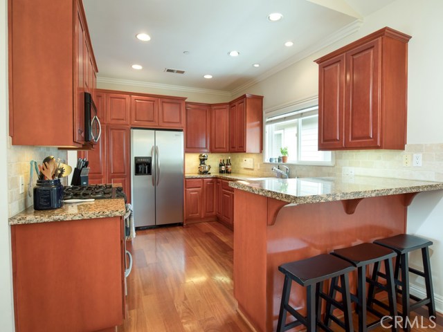 Chef’s kitchen that features a breakfast bar seating