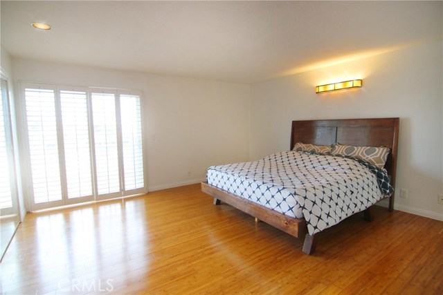 Master bedroom featuring slider doors to private balcony where you can enjoy an evening view of the eastern city lights.