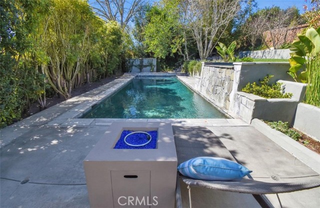 Imaging the fireplace lit and the fountain streaming down with all the hidden lighting around this pool area... nighttime looks better than daytime in my opinion!