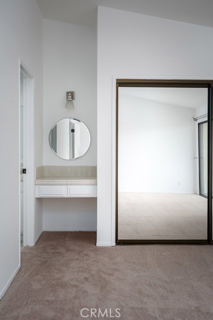 North Side Master Bedroom with Vanity and Mirrored Wardrobes.