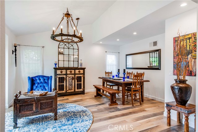Engineered French oak, wide-plank flooring sweeps throughout the home