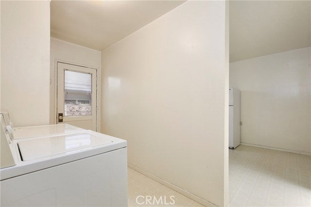 Unit B - View into Laundry Room and Kitchen