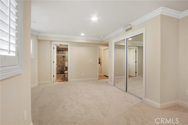 VERY SPACIOUS LOWER LEVEL BATHROOM WITH MIRRORED CLOSET DOORS & DIRECT ENTRY TO THE GARAGE