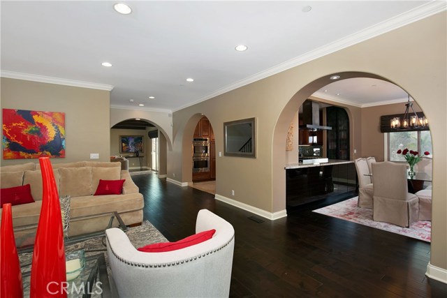 view from living to dining, kitchen & family room