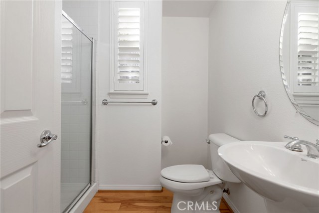 Three-quarter bathroom downstairs- a full storage cabinet (behind the door) for when over-night guests turn into 