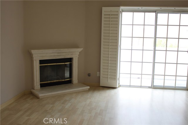 Master bedroom with fireplace, walk-in closet and balcony overlooking patio