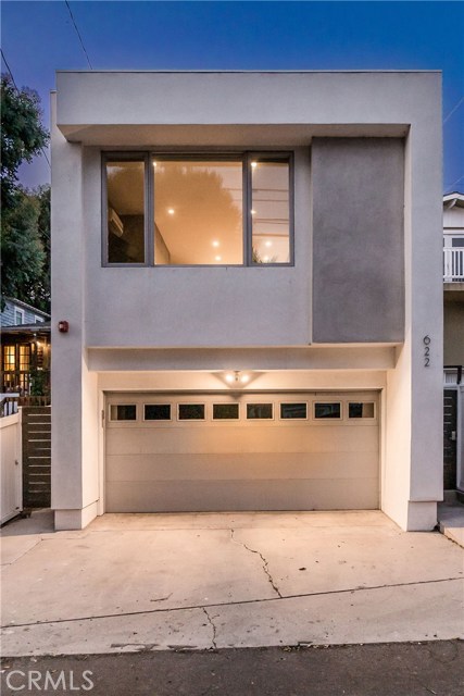 Pull into this architecturally stunning two car garage, built in 2016, and guest house above.