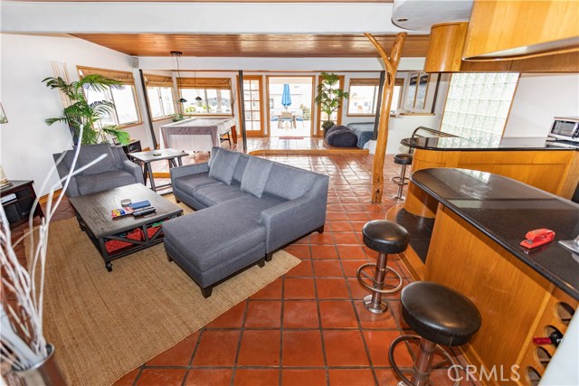 Large, Open living area with French doors opening to very spacious deck.