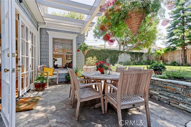 Outdoor patio is perfect for entertaining and overlooking grassy yard.