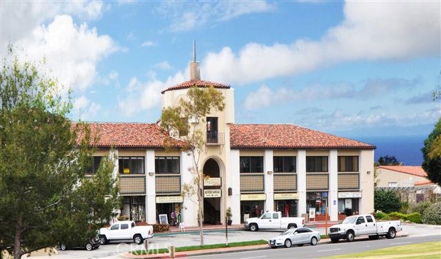 View of The Lunada Bay Patio Building and  the adjacent Lunada Bay Plaza with its shops, grocery, eateries, hardware store, gas station, bank and services. Imagine summer concerts in the park and a stroll to the ocean bluffs. All this at your doorstep when you live at Unit 107!