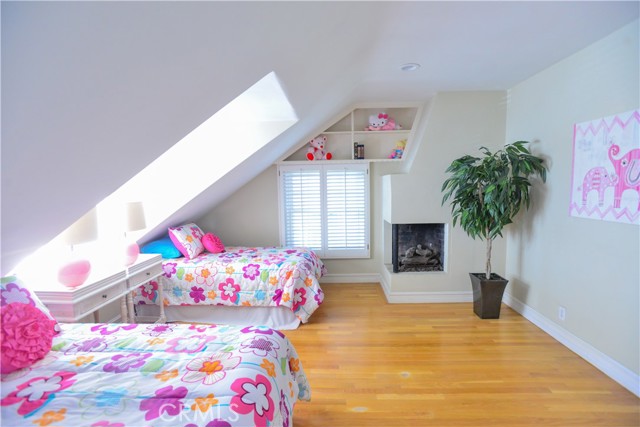 Upstairs bedroom with fireplace with west facing views. A great room to check out the surf for the day,