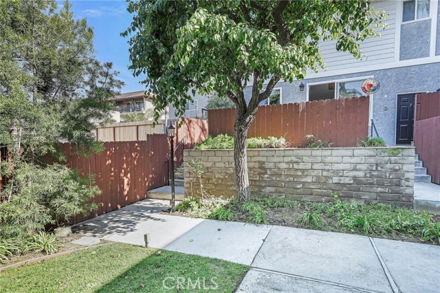 Front of this End Unit Townhouse, entrance is on right, Fence is around enclosed Patio.