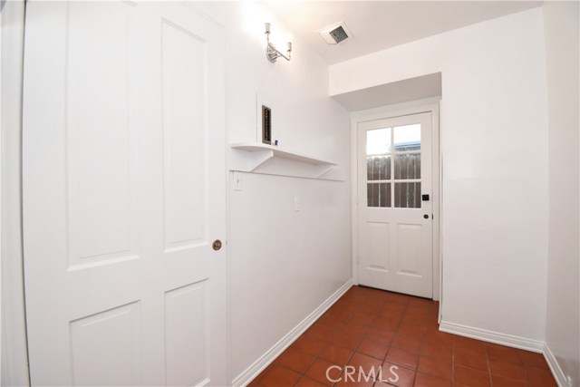 Laundry room, with a side door to the side yard.